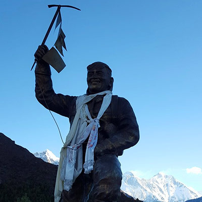 Morning sunrise with the statue of the most famous climbing sherpa of all time, Tenzing Norgay, with everest in the background.